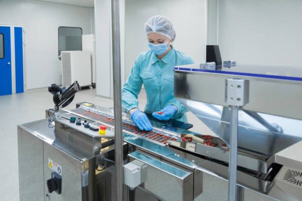 Staff performing manual inspection on the production line
